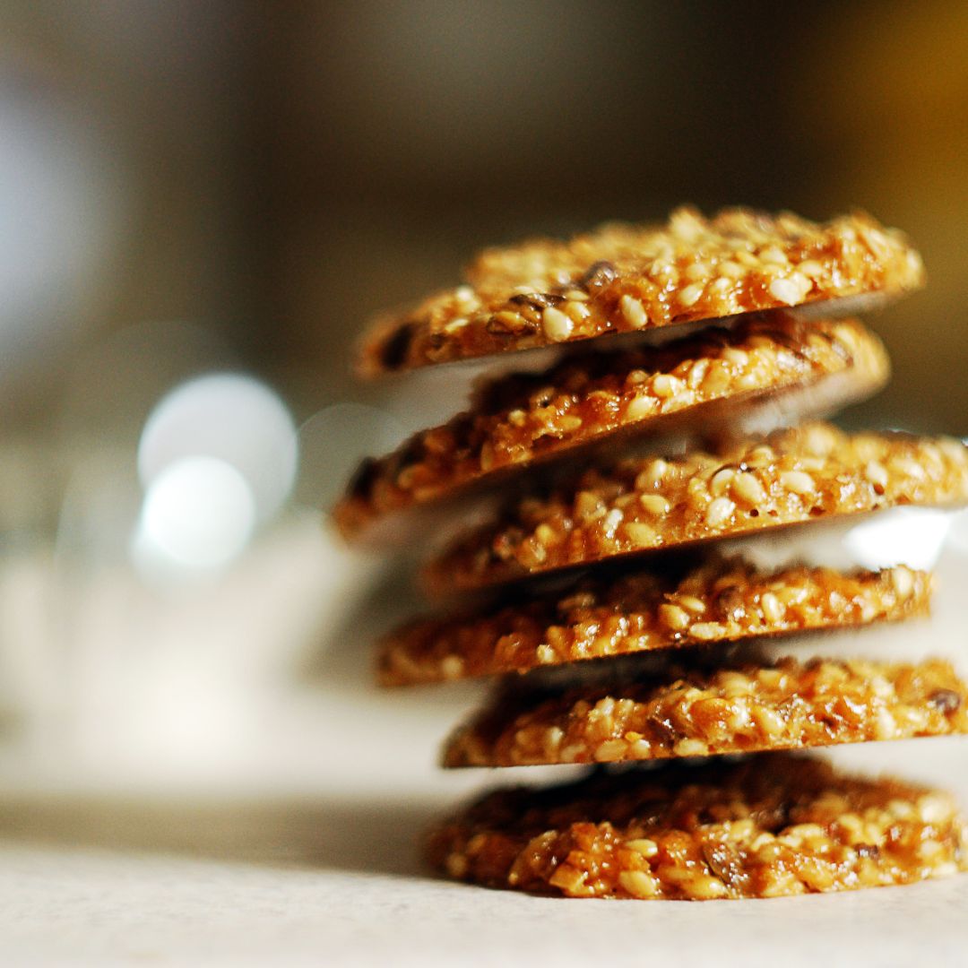Homemade savoury oatcakes with seeds packed as a healthy travel snack.